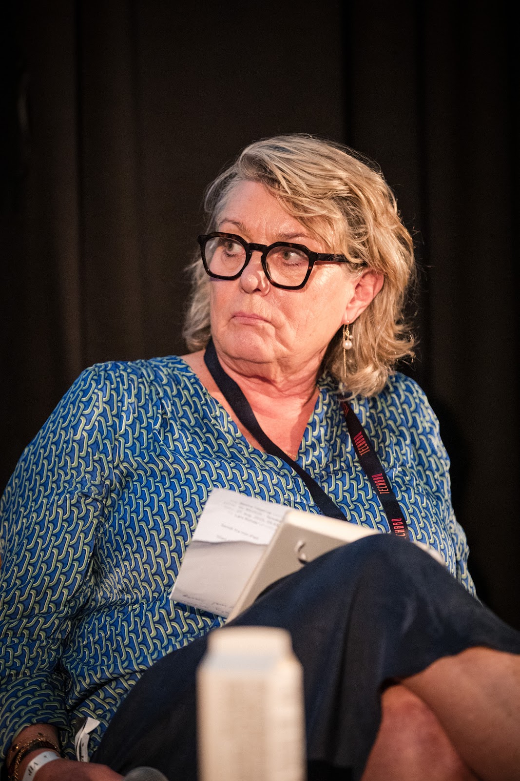 Panel speaker with notes at Board Summit 2025
